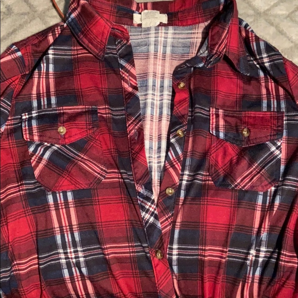 Plaid button shirt.